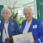 Alumnae sisters Helen Anderson and Ginnie Humphrey check out the artwork offered at Smith Day