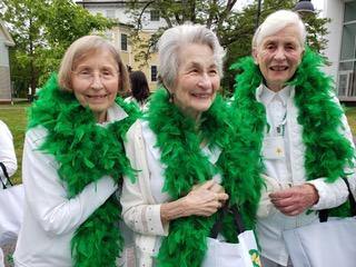 Ivy Day parade with green feather boas